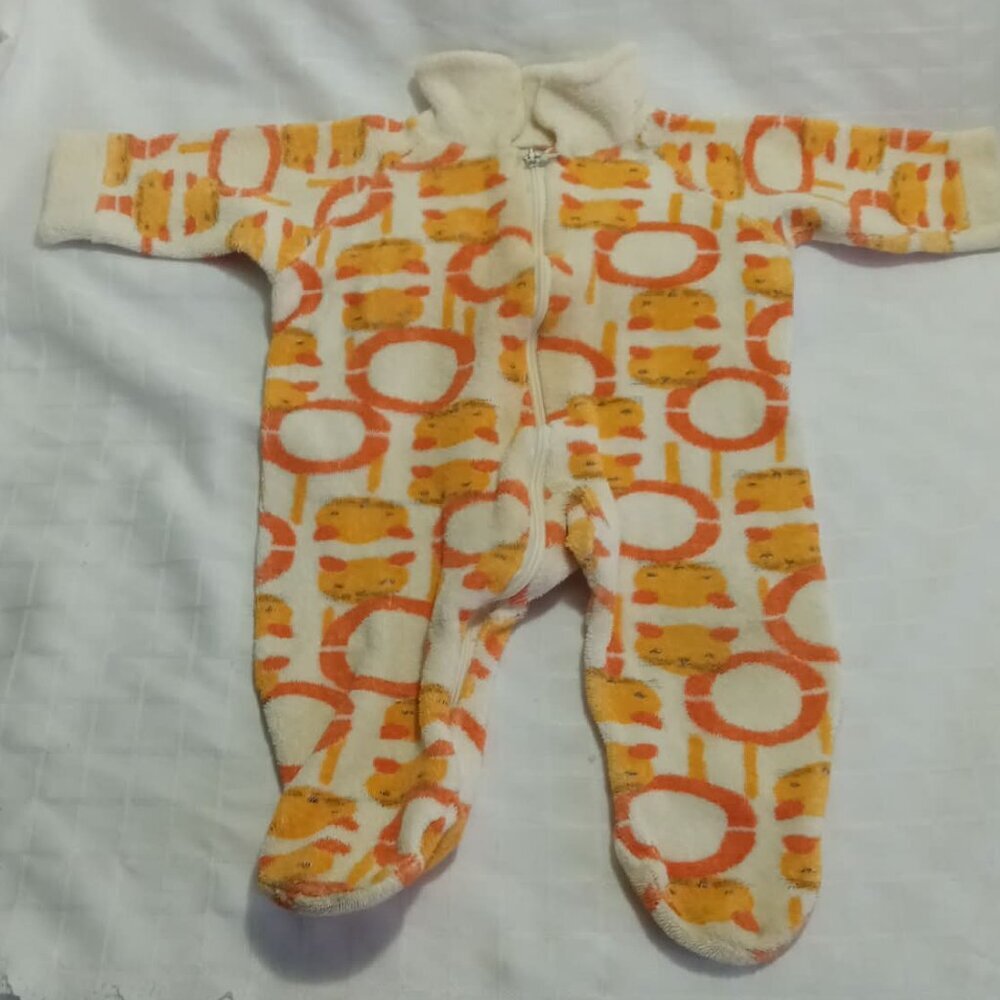 Vintage very little baby sleeper with a white and orage pattern, 1977, newborn